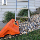 Staybull Multi-Base used to level extension ladder on side sloping yard