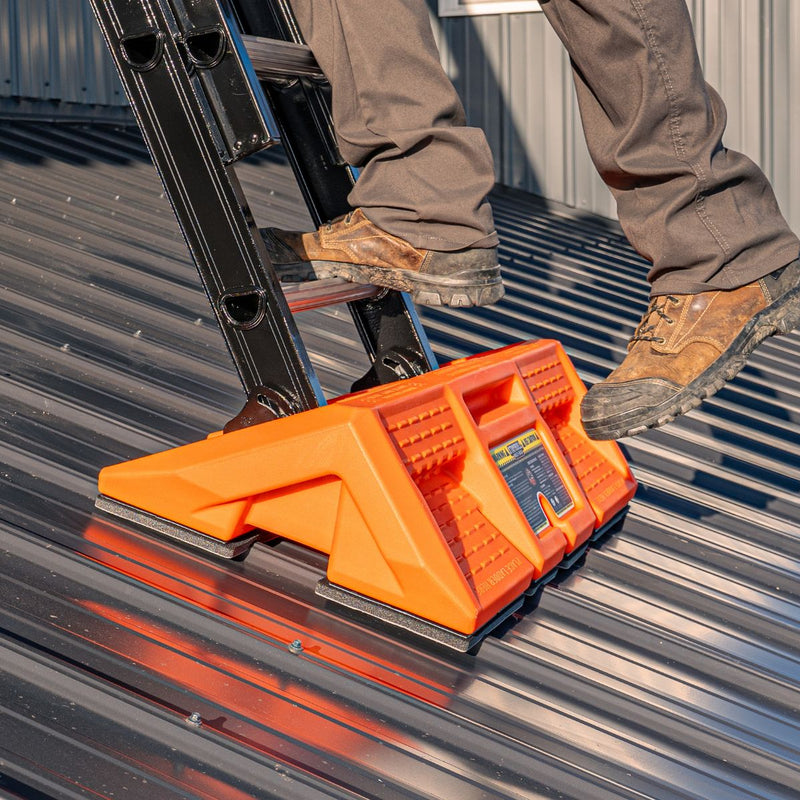 Staybull Multi‑Base ladder stabilizer positioned on a corrugated metal roof