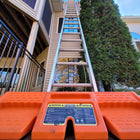 Staybull Multi-Base securing tall ladder on patio